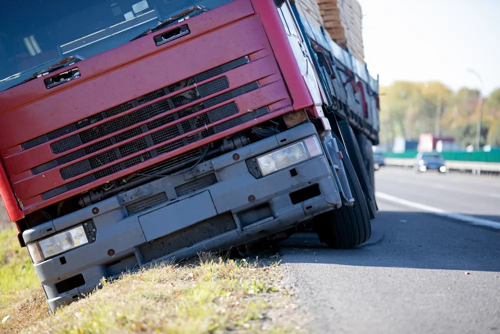 Truck accident. Lorry trailer car lost control, left interstate road and plunges into ditch
